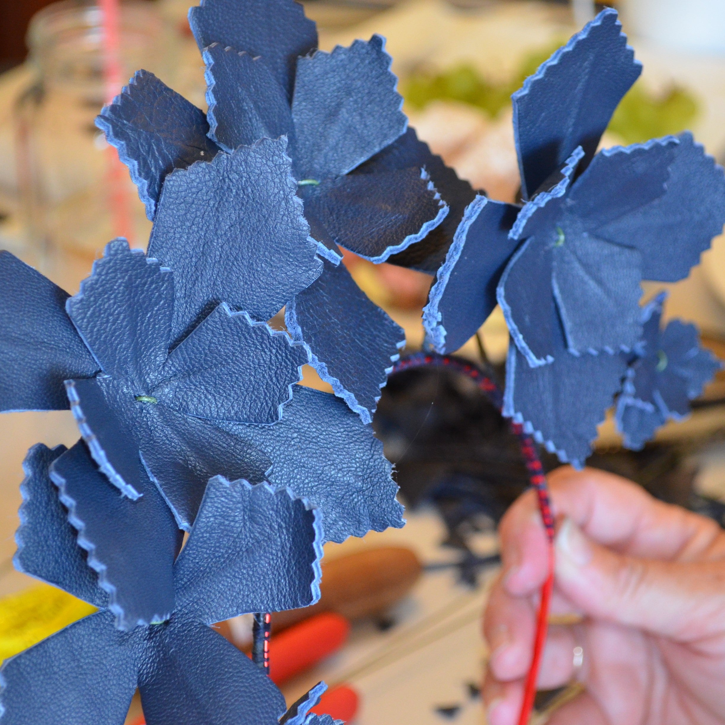 Handmade blue leather flowers made by milliner Rebecca Share