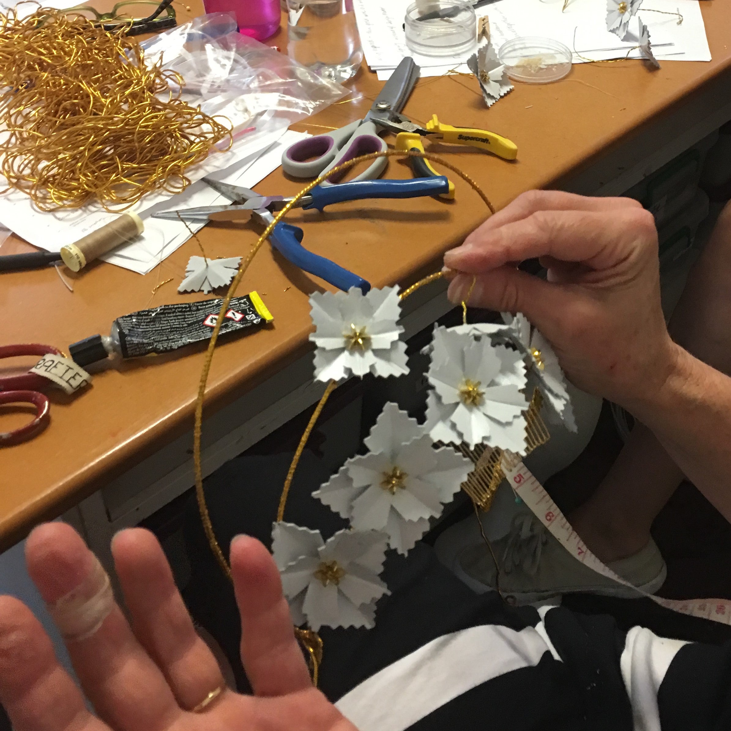 White Leather Flowers being created by a student in Rebecca Share Millinery Workshop