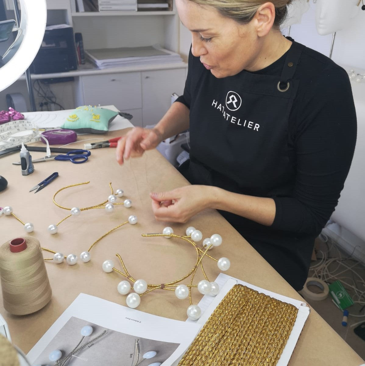Milliner Rebecca Share working in her studio on bridal millinery headwear